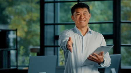 Asian businessman professional business agent hold mortgage contract documents korean japanese man...