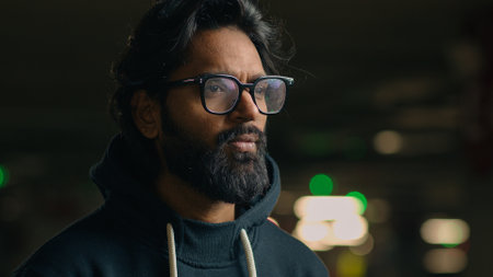 Pensive thoughtful thinking man male puzzled pondering think guy at dark looking away ponder decision solution serious waiting hesitate unsure wait problem solving aloneの写真素材