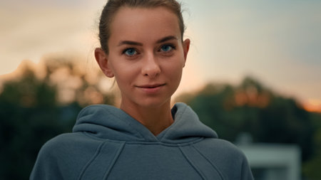 Portrait of caucasian fitness girl motivated sportswoman athletic beautiful female in sportswear posing on city street strong fit woman healthy model stand at confident pose health and sport conceptの写真素材