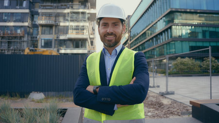 Smiling Caucasian middle-aged adult man worker in hardhat happy smile contractor engineer in helmet...