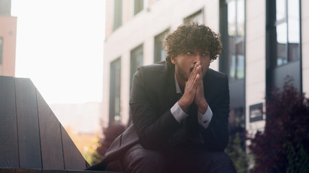 Indian businessman Arabian business man employer entrepreneur think problem analysis issue trouble annoyed anxiety stress ponder thinking anxious bad bankrupt worker bankruptcy brainstorming in cityの写真素材