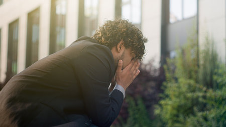 Anxious thinking stressful thoughtful leader worker bankrupt male business manager think solution problem man suffer unwell trouble migraine headache symptom failure Indian businessman stress in cityの写真素材