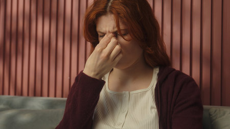 Unwell sad tired woman Caucasian girl female at home suffer migraine headache symptom pain touch...