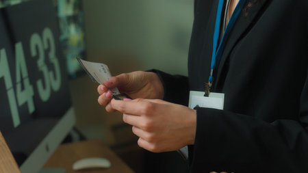 Unrecognizable woman concierge worker hotel reception give flight ticket check passport registration service tourist traveler passenger man arrive travel business trip tourism airport terminal controlの写真素材