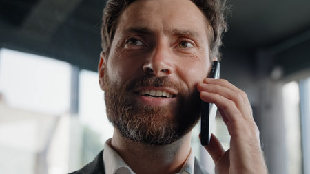 Closeup Caucasian smiling bearded man answer call calling friendly talk virtual consultation boss...