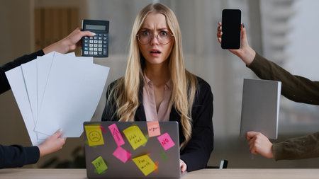 Multitasking business woman manager in office sitting at table have many tasks work feeling stress...
