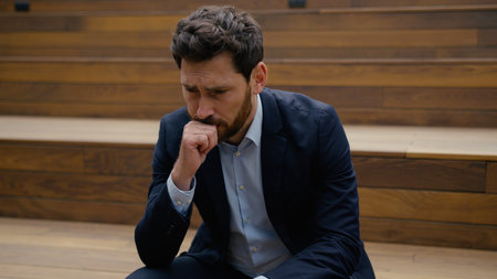 Sad man guy Caucasian depressed male businessman business employer think problem health trouble headache worried upset worker thinking alone outdoors city work loss crisis tired exhausted concern failの写真素材