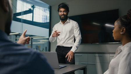 Arabian Indian businessman male leader man mentor report share idea startup project presentation corporate training office meeting multiracial business team brainstorming working in company togetherの写真素材