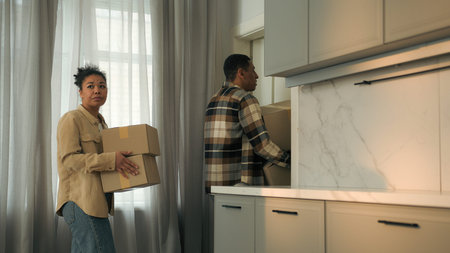 Frustrated sad couple ethnic woman man African American family upset worried home owners tenants...