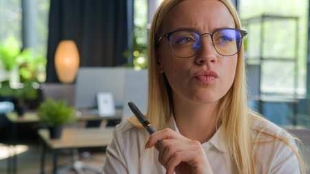 Portrait thoughtful puzzled girl student Caucasian businesswoman in glasses think business idea...
