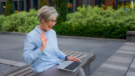 Excited happy Caucasian 50s businesswoman old retired woman mature middle-aged business lady talking...