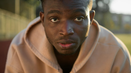 African American strong man ethnic male sportsman looking away outdoors portrait fitness trainer guy...