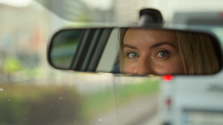 Caucasian girl woman hands female driving rental car driver traveling transport in city automobile road trip businesswoman touching steering wheel roadway auto unrecognizable lady travel vehicle ownerの写真素材