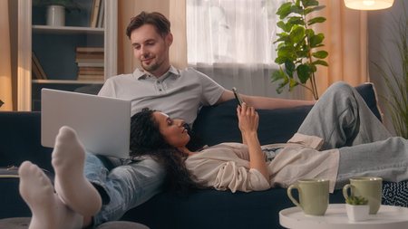 Gadget addict family internet addiction couple Caucasian man freelancer guy male using laptop...