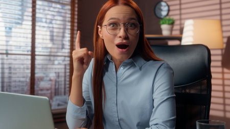 Caucasian marketing manager employer woman business girl female businesswoman worker in office working laptop online work thinking job solution pensive decide smile happy come up with idea find answerの写真素材