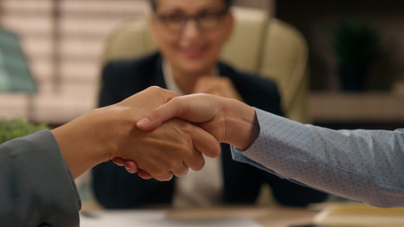 Caucasian businesswoman woman female office business deal shaking hands agreement contract director...