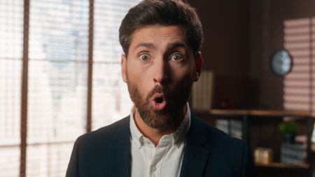 Close up face shocked amazed stunned mature business man looking at camera with big eyes open mouth...