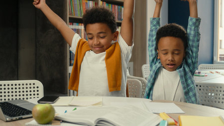 African American little boys ethnic children siblings pupils students schoolboys writing exercise...