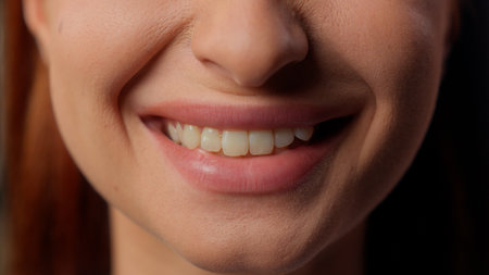 Close up female lips smiling teeth healthy toothy smile closeup mouth business woman girl happy showing tooth dental oral care stomatologic health medicine whitening unrecognizable lady cropped viewの写真素材