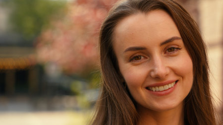 Portrait in city headshot outdoors close up street outdoor Caucasian woman carefree smiling girl positive satisfied female lady smile healthy teeth face medicine businesswoman emotional business gladの写真素材