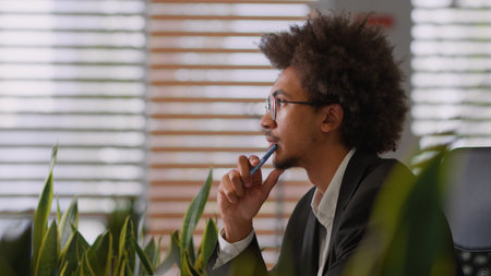 Pensive dream thoughtful African American man male business working corporate creative job work businessman think ideas thoughts search difficult startup solve doubt thinking office hesitate projectの写真素材