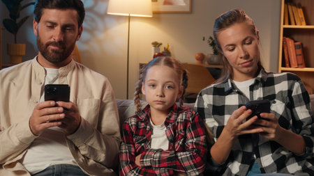 Caucasian family parents mother father using mobile phone smartphones scrolling gadgets addict...