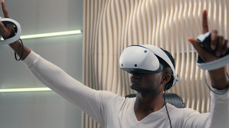 African American ethnic man male guy playing VR game innovation internet gaming interactive...