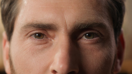 Close up man Caucasian portrait bearded guy adult businessman tenant homeowner husband thoughtful male at home apartment looking at camera human eyes opening wrinkles face middle-aged health eyesightの写真素材