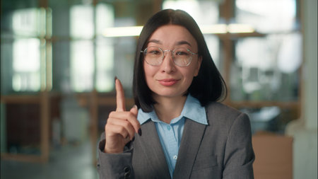 Asian Chinese Korean business woman thinking girl Japanese female thoughtful dreaming indoors office manager architect industry worker happy businesswoman choose think ponder mind create idea insightの写真素材