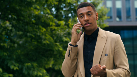African American man business entrepreneur employer talking mobile phone businessman guy male talk...