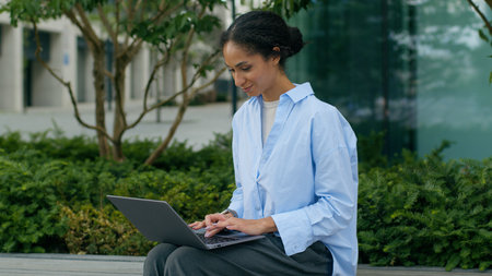 African American businesswoman employer woman business girl female lady manager worker entrepreneur student freelancer working online typing laptop chat studying e-learning internet computer at cityの写真素材