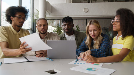 Group of multiracial diversity students e-learning together studying in high school pupils gathering...