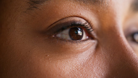 Close up eye face African American woman female girl businesswoman mascara eyelashes portrait detail...