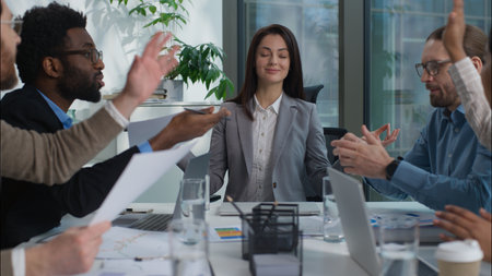 Caucasian businesswoman leader woman meditating sitting in lotus position office calm peaceful boss manager multinational diversity businesspeople business team colleagues employees arguing conflictの写真素材