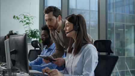 Call center inspection multiethnic operators working online consulting helpline customer support at...