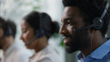 Callcenter headshot African operator in headset support customer helpline online sales business...