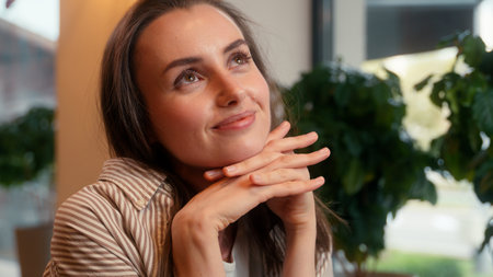 Caucasian dreaming inspired woman visitor in cafe business lady calm dream thinking pondering happy smiling girl female at cafeteria table relaxing portrait customer daydream enjoying coffeehouseの写真素材