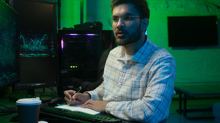 Indian Arabian man businessman programmer hacker IT specialist business male ethnic guy studio home...
