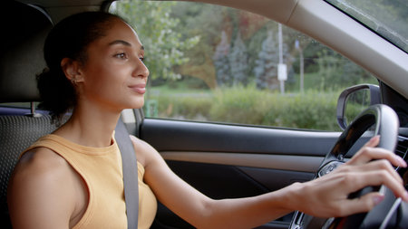African American driver woman businesswoman safe driving car city road girl automobile steering...