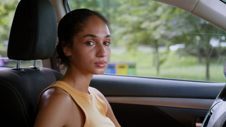 Sad African American woman stressed girl female driver car automobile transport vehicle auto looking...