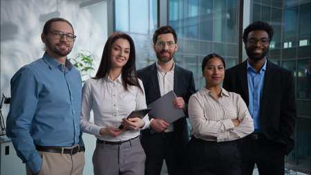 Happy Caucasian African American Indian businesswomen businessmen office corporate portrait pose...