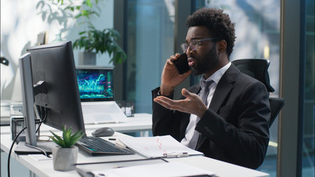Confused African American man employee talking mobile phone businessman business cellphone looking...