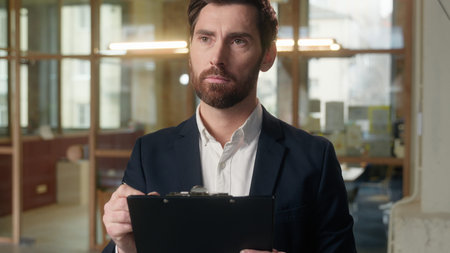 Pensive businessman thoughtful Caucasian business man writing notes in office workplace text...