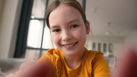 Webcam display point of view POV screen modern happy Caucasian little child girl daughter scrolling...