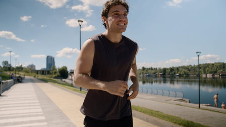 Happy excited energetic Caucasian man runner run jogger smile successful sport male enjoy open arms...