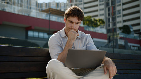 Caucasian thoughtful man thinking working laptop computer freelancer male guy businessman business...