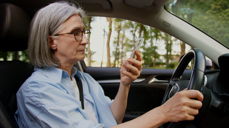 Caucasian elderly mature female woman senior auto taxi driver car owner pensioner tourist traveler...