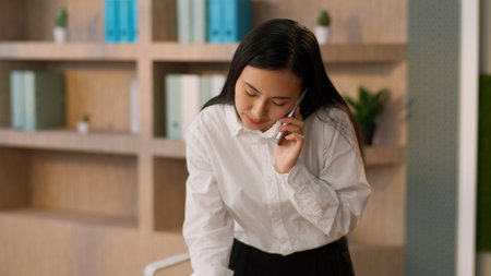 Smiling professional Asian Japanese businesswoman manager female worker Chinese Korean business...