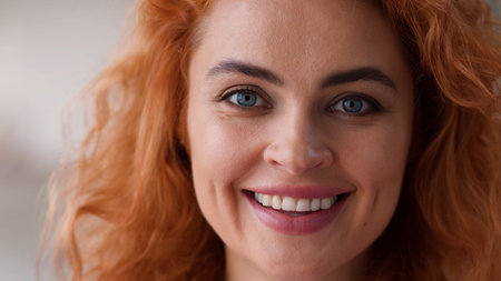 Portrait Caucasian redhead woman looking at camera head look smiling toothy dental health teeth medicine healthcare girl female wife girlfriend mother headshot face smile indoors good mood satisfiedの写真素材