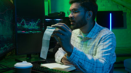 Arabian Indian man male guy programmer examining writing binary code coder freelancer engineer...